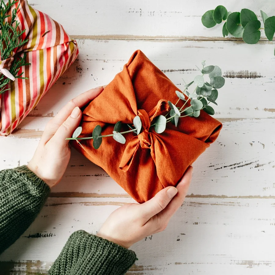 wrapping-a-gift-in-eco-friendly-reusable-fabric-pa-2022-01-19-00-09-44-utc